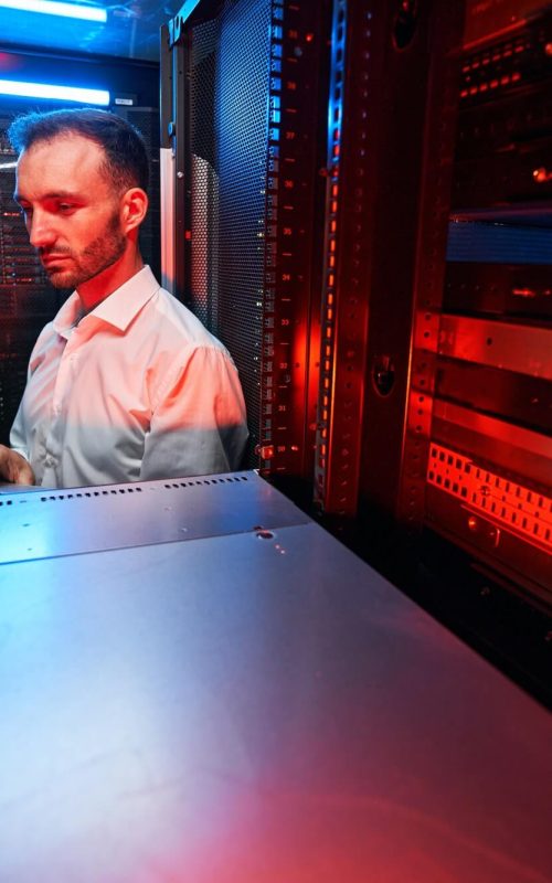 data-center-administrator-inspecting-server-rack-software-1.jpg